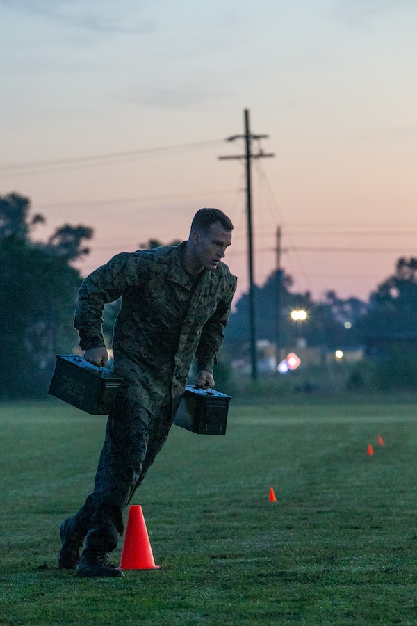 U.S. Marine Corps Capt. Kevin Zimmerman, a Sellersville, Pennsylvania, native and an infantry officer with 3rd Battalion, 2d Marine Regiment, 2d Marine Division, conducts a run with ammo cans  during the Division Leader Assessment Program 4-22 on Camp Lejeune, North Carolina, Sept. 7, 2022.