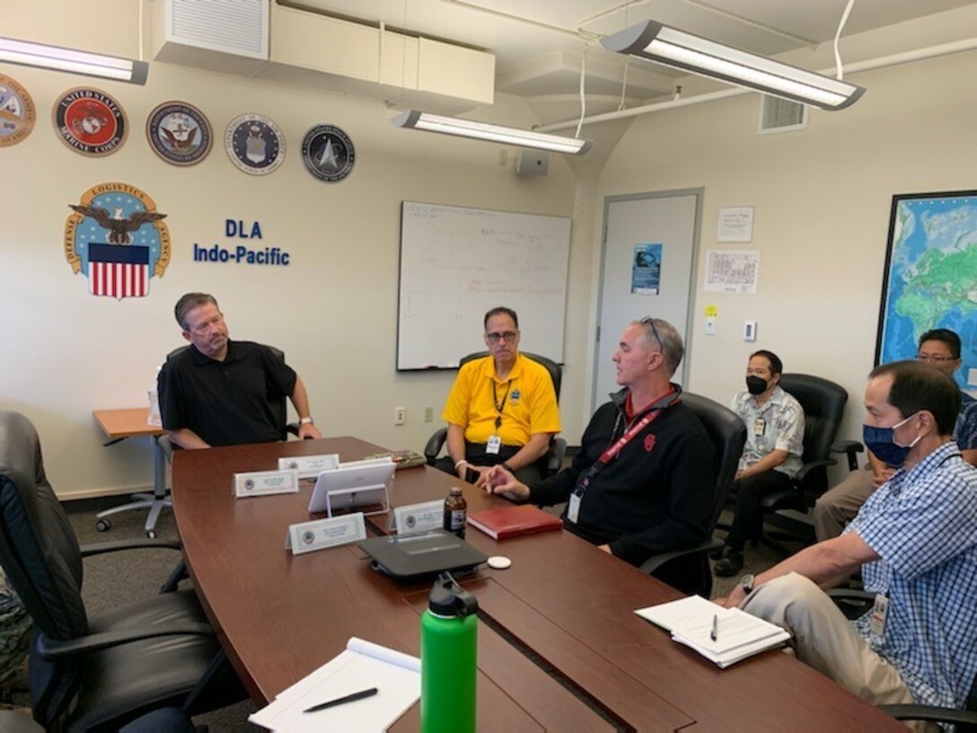 Brad Bunn, Defense Logistics Agency vice director, (left) listens to a brief from John Hamilton, site director DLA Installation Management Indo-Pacific, on the organization’s capabilities at Joint Base Pearl Harbor-Hickam, August 22-26.