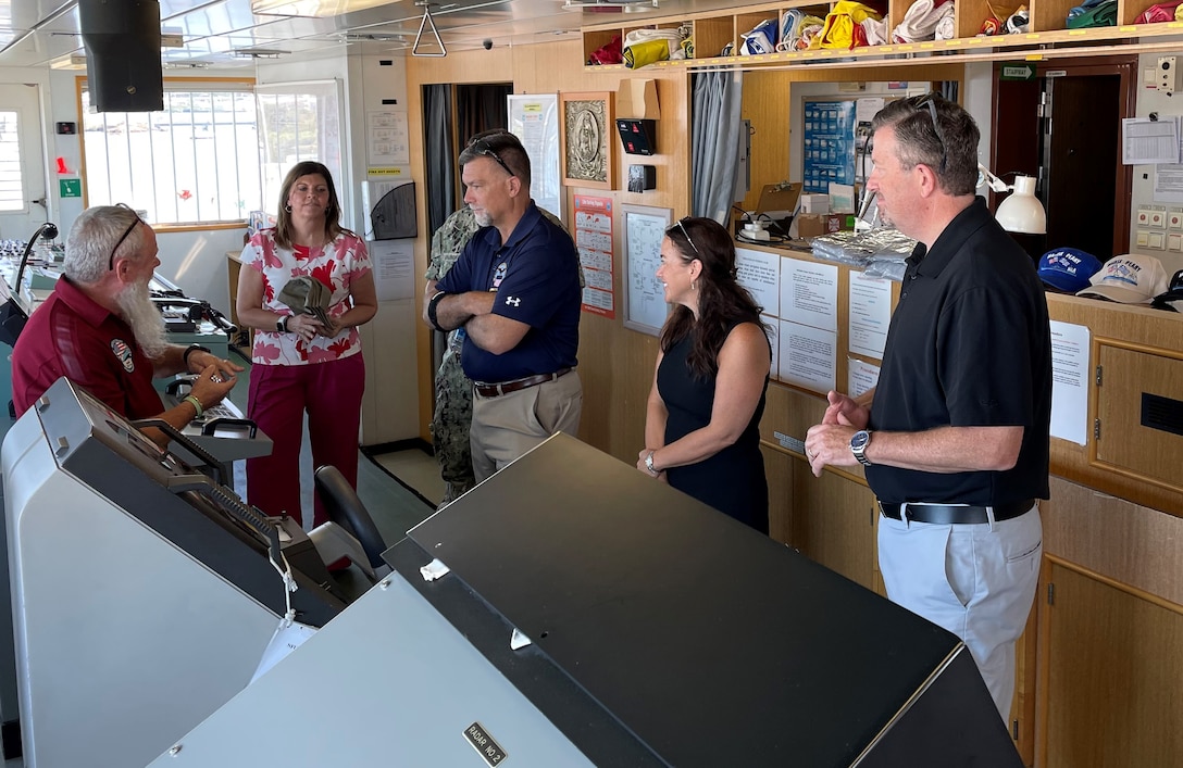 Brad Bunn, Defense Logistics Agency vice director, listens to a brief from John Hamilton, site director DLA Installation Management Indo-Pacific