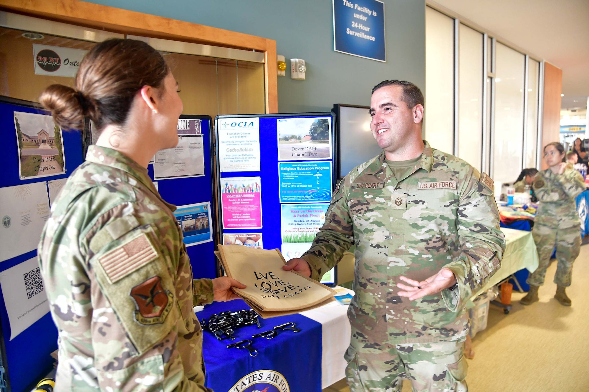 From the left, 1st Lt. Rebecca Petit, 436th Airlift Wing chaplain, speaks to Master Sgt. Charles Swaggart, 9th Airlift Squadron first sergeant, at the Human Performance and Wellness Event on Dover Air Force Base, Delaware, Sept. 8, 2022. The chapel was one of several base agencies featured at the event. (U.S. Air Force photo by Senior Airman Faith Barron)