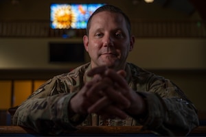 Maj. Matthew Clouse, 7th Bomb Wing deputy chaplain assistant, poses for a photo inside the 7th Bomb Wing chapel, Dyess Air Force Base, Jul. 14, 2022. Clouse was inspired to join the military while attending seminary school following the events of Sept. 11, 2001. (U.S. Air Force photo by Senior Airman Colin Hollowell)