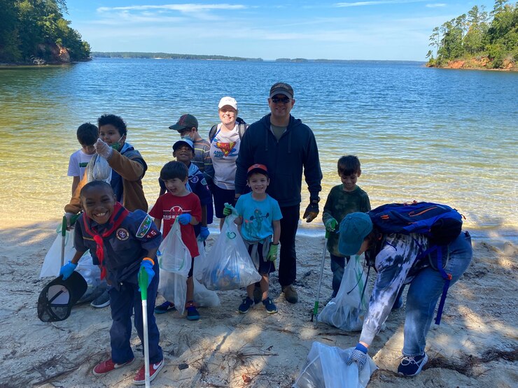 Children pick up trash during a 2021 National Public Lands Day event at J Strom Thurmond Lake. The children collected approximately 220 pounds of trash and cleared 1.75 miles of shoreline. U.S. Army Photo by Susan Miller