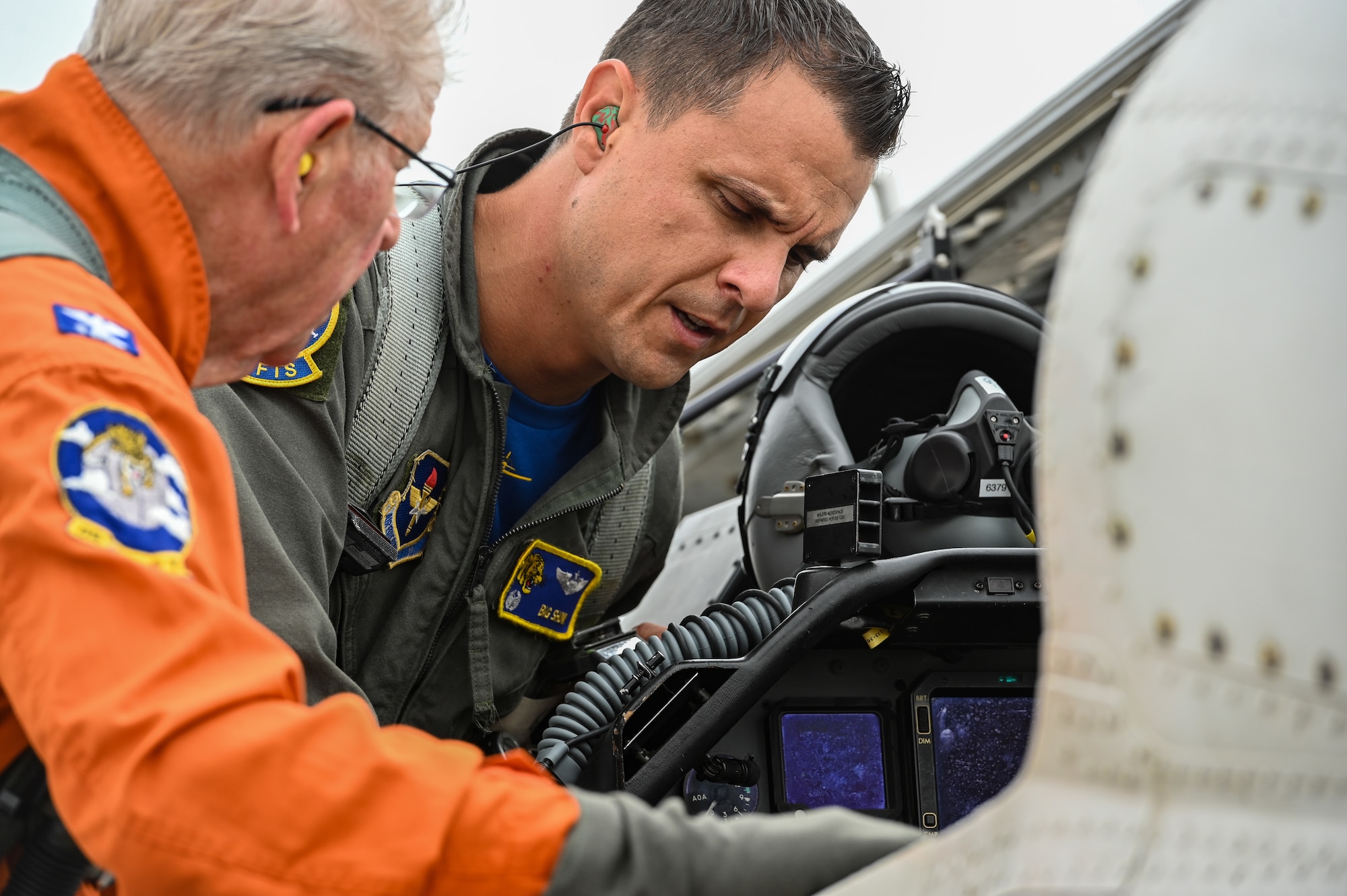 U.S. Air Force Lt. Col. Gregory Show, 85th Flying Training Squadron commander, right, and retired Col. Dale Ullrich, previous 85th FTS commander, left, look inside the cockpit of a T-6 Texan II on the flightline at Laughlin Air Force Base, Texas, on Sept. 2, 2022. The 85th FTS celebrated its 50th anniversary at Laughlin by showcasing the modern pilot training experience to previous members and commanders. (U.S. Air Force photo by Airman 1st Class Keira Rossman)