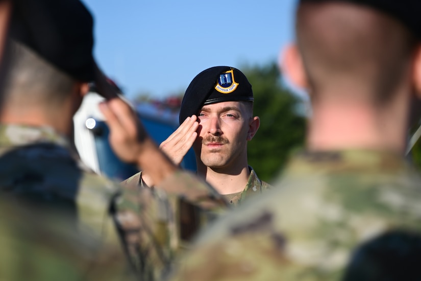 Capt. Justin Fitzwater, 816th Security Forces Squadron operations officer, salutes an Airman during a 9/11 remembrance ceremony at Joint Base Andrews, Md., Sept. 9, 2022. Fitzwater lead a flight of first responders in honor of the lives lost in the terrorist attacks on Sept. 11, 2001. (U.S. Air Force photo by Airman 1st Class Isabelle Churchill)