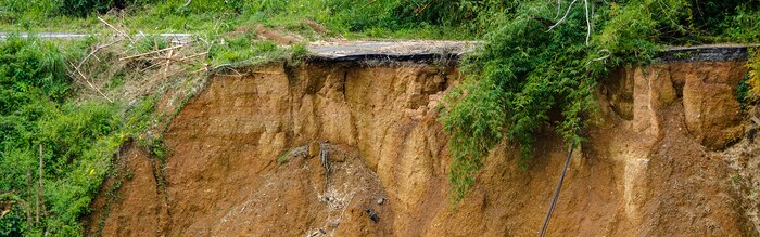 Barranquitas, Puerto Rico, Feb. 13, 2018—FEMA Region VII Administrator Paul Taylor, with Region II personnel and the municipality’s Mayor, Francesco Lopez, tour damage from Hurricane Maria. Not far from the center of town a landslide has collapsed a section of road. FEMA/K.C. Wilsey