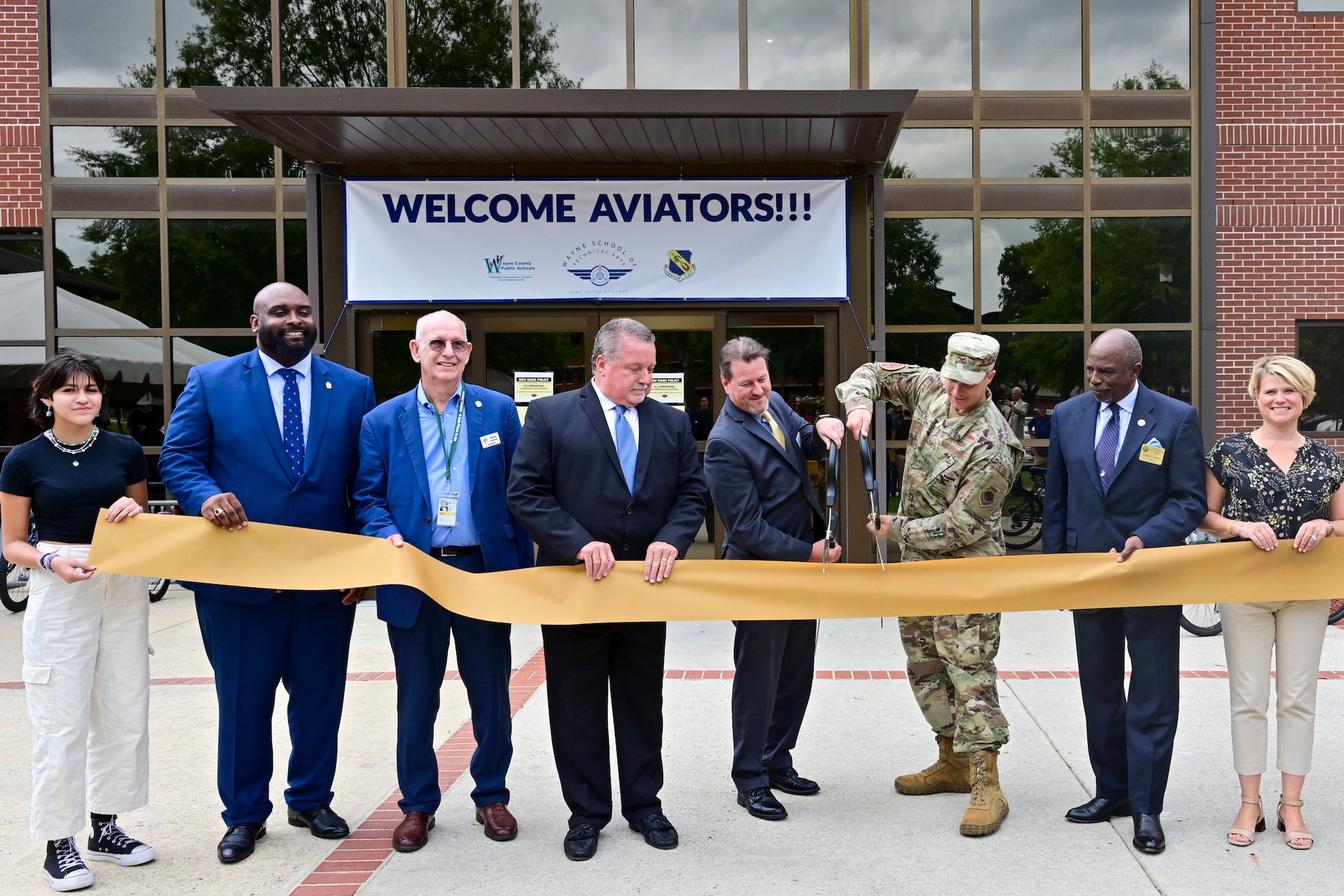 Col. Lucas Teel, 4th Fighter Wing commander, and Dr. David Lewis, Wayne County Public Schools superintendent, cuts a ribbon during a ceremony to recognize the opening of the Wayne School of Technical Arts at Seymour Johnson Air Force Base, North Carolina, Sept. 9, 2022. (U.S. Air Force photo by Senior Airman Kevin Holloway)