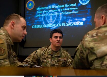 Staff Sgt. Nathan Proulx, Tech. Sgt. Alan Dwyer (left), and Master Sgt. Robert Bell, of the 157th Communications Flight, prepare to brief the Salvadoran military's cyber security team during a four-day, cyber exchange under the NHNG-El Salvador State Partnership Program at the Centro de Etrenamiento Tactico in San Salvador, El Salvador on Aug. 24, 2022. Photo by Staff Sgt. Victoria Nelson, 157th ARW PA.