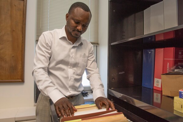 David Tamakloe, auditor with the U.S. Army Corps of Engineers Nashville District Internal Review Office, works at the district’s headquarters in Nashville, Tennessee, Aug. 24, 2022. He shared is life’s journey that led him from a refugee as a child in war-torn Liberia, to immigrating to the United States, to fulfilling his desire to give back to America as an employee of the Corps of Engineers. (USACE Photo by Lee Roberts)