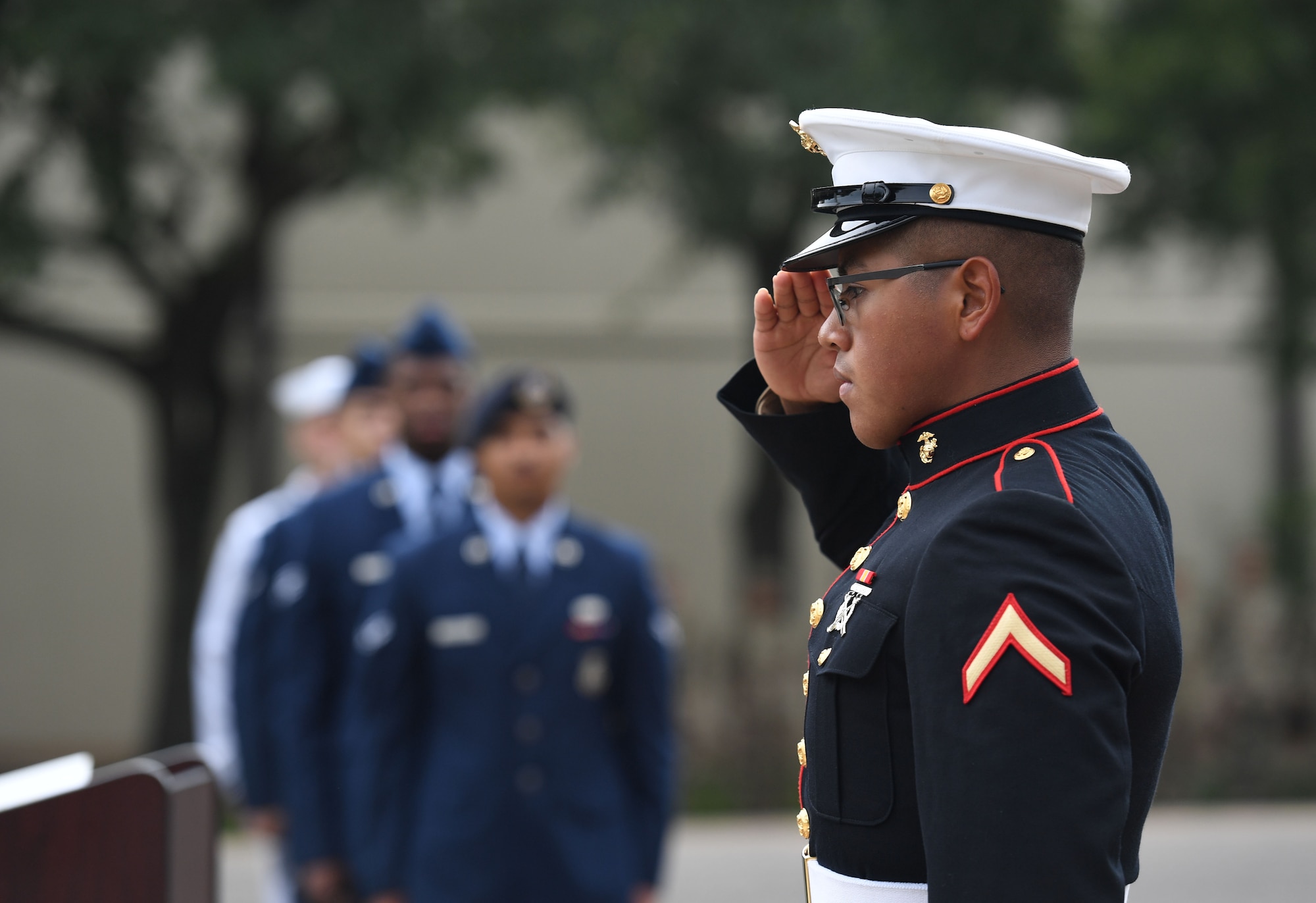 U.S. Marine Private 1st Class Diego MoralesCabrera, Keesler Marine Detachment student, renders a salute during a 9/11 ceremony in front of the 81st Training Wing headquarters building at Keesler Air Force Base, Mississippi, Sept. 9, 2022. The event honored those who lost their lives during the 9/11 attacks. (U.S. Air Force photo by Kemberly Groue)
