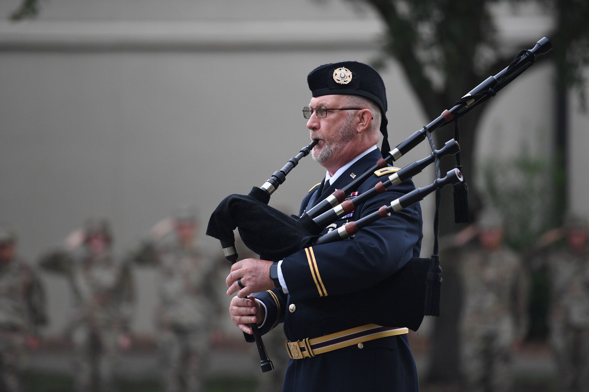 U.S. Army Retired Col. Bill Christmas plays "Amazing Grace" on his bagpipes during a 9/11 ceremony in front of the 81st Training Wing headquarters building at Keesler Air Force Base, Mississippi, Sept. 9, 2022. The event honored those who lost their lives during the 9/11 attacks. (U.S. Air Force photo by Kemberly Groue)