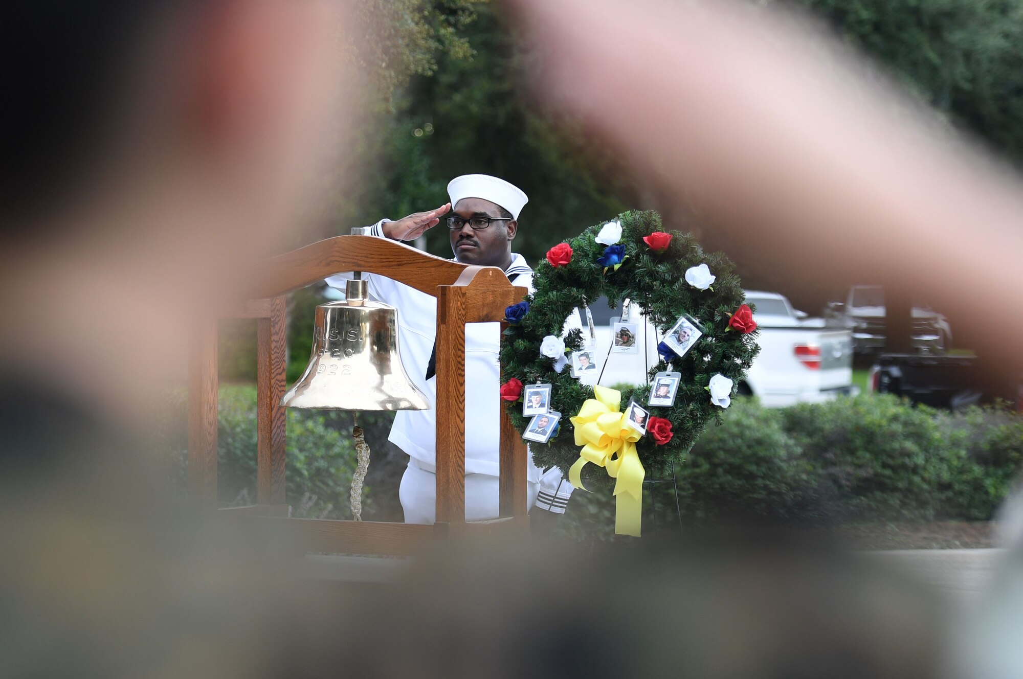 U.S. Navy Electricians Mate 2nd Class Aaron Buchanan, Center for Naval Aviation Technical Training Unit Keesler instructor, renders a salute during a 9/11 ceremony in front of the 81st Training Wing headquarters building at Keesler Air Force Base, Mississippi, Sept. 9, 2022. The event honored those who lost their lives during the 9/11 attacks. (U.S. Air Force photo by Kemberly Groue)