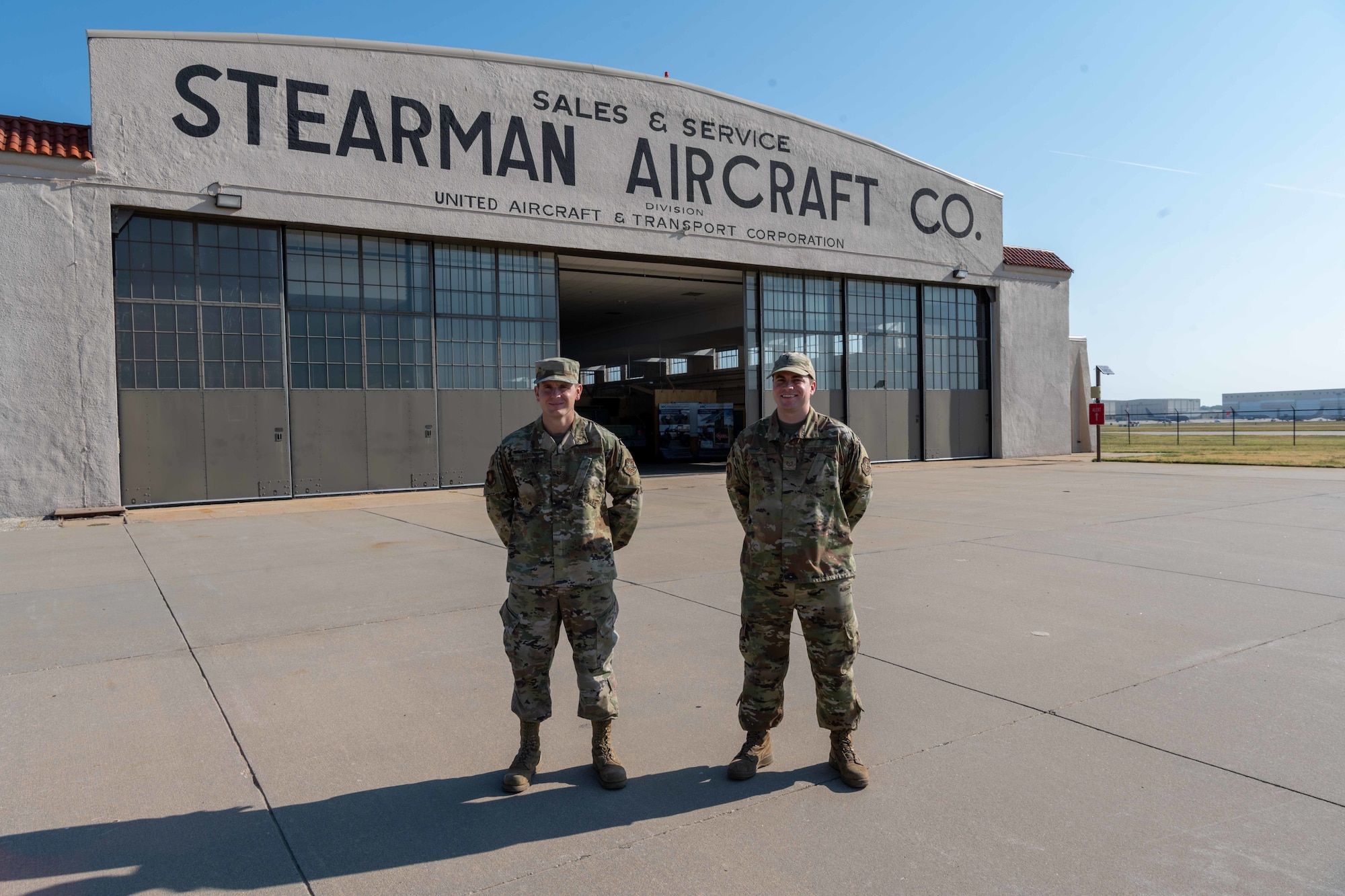 Airmen from the 22nd Air Refueling Wing Innovation Lab, pose for a photo outside their building Sept. 1, 2022, at McConnell Air Force Base, Kansas. The Innovation Lab is for Airmen to use tools to build new parts, 3-D print and learn how to operate various machines. (U.S Air Force photo by Airman William Lunn)