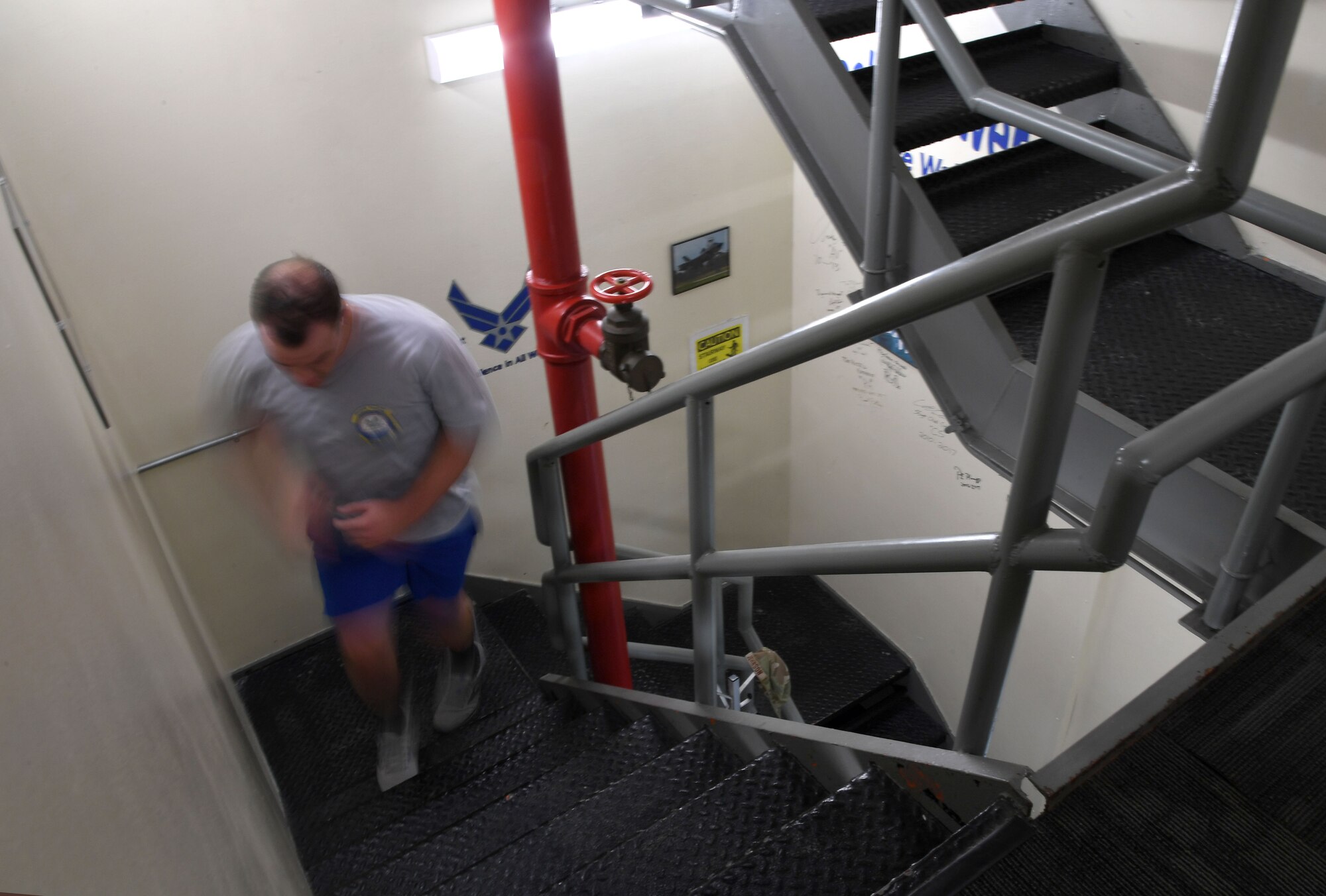 U.S. Air Force Capt. Nick Juliano, 81st Operations Support Flight commander, runs up a flight of stairs during the 9/11 Tower Run inside the air traffic control tower at Keesler Air Force Base, Mississippi, Sept. 9, 2022. The event honored those who lost their lives during the 9/11 attacks. (U.S. Air Force photo by Kemberly Groue)