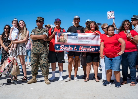 NORFOLK (Sept. 9, 2022) Families and friends await to embrace their Sailors after the Arleigh Burke-class guided-missile destroyer USS Bainbridge (DDG 96) returned to Naval Station Norfolk from a regularly scheduled deployment in the U.S. 6th Fleet area of operations in support of theater security cooperation efforts and to defend U.S., allied and partner interests, Sept. 9, 2022. Bainbridge was deployed as part of the Harry S. Truman Carrier Strike Group. (U.S. Navy photo by Mass Communication Specialist 1st Class Ryan Seelbach)