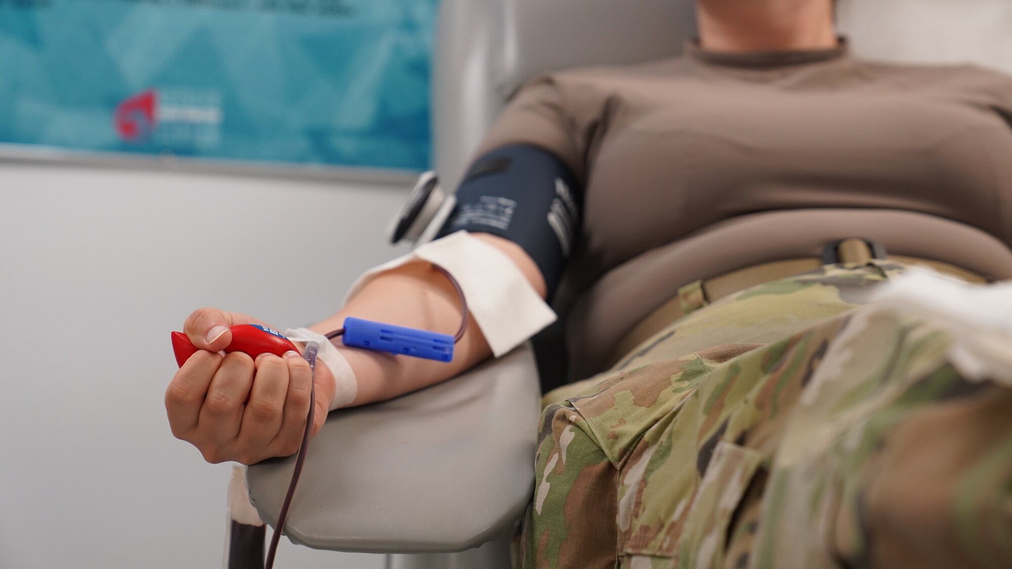 U.S. Air Force Senior Airman Kimberly Mueller, 81st Training Wing Public Affairs command information lead, tightly squeezes a foam ball to promote blood flow while donating at the Blood Donation Center on Keesler Air Force Base, Mississippi, Sept. 9, 2022. The BDC’s mission is to support the Armed Services Blood Program by collecting, processing, storing, distributing and transfusing blood worldwide in times of peace and war.