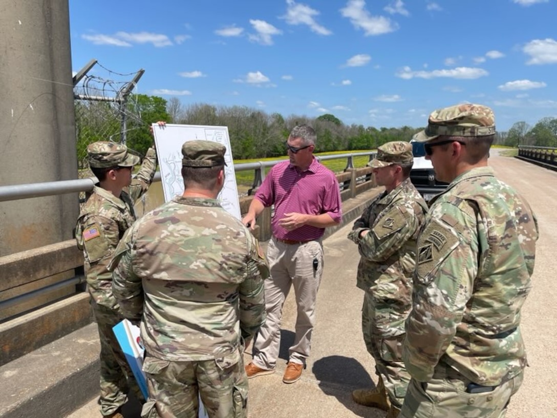 Programs and Project Management Division Deputy Chief Jacob Brister briefs military officers from the Mississippi Valley Division, the Vicksburg District and the U.S. Army Engineer Research and Development Center on the Yazoo Backwater are project.