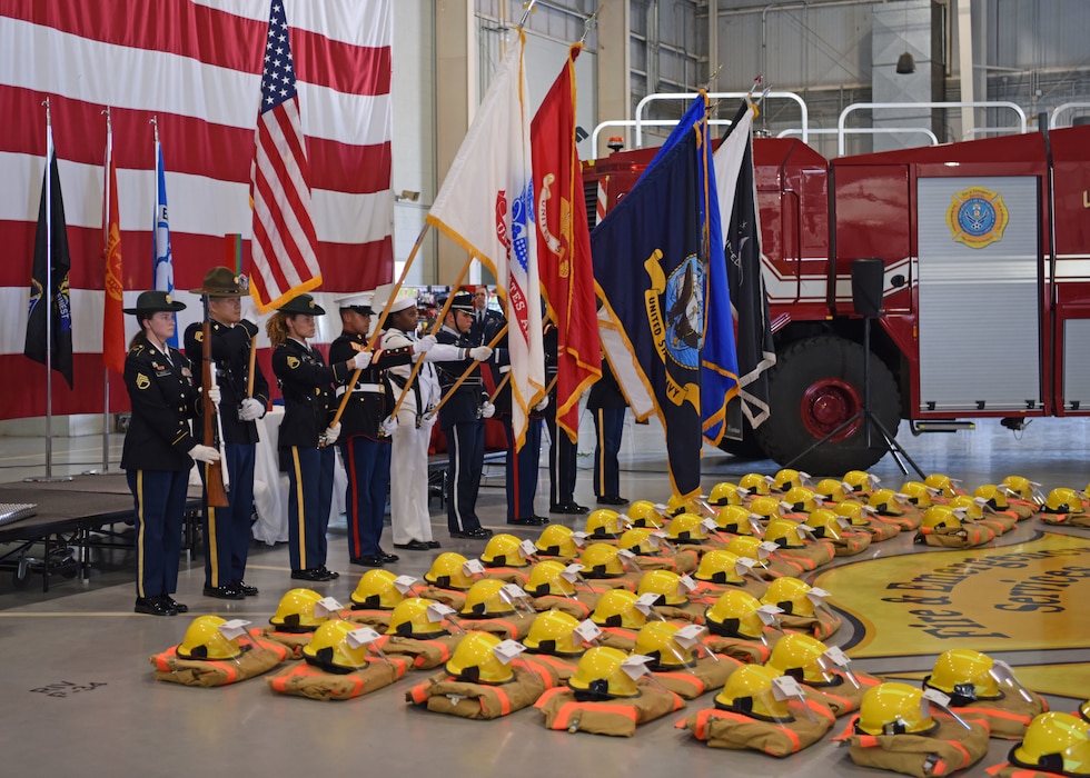 The Goodfellow Air Force Base Joint Service Color Guard presents the colors to begin the 312th Training Squadron’s 9/11 memorial ceremony at the Louis F. Garland Department of Defense Fire Academy high bay, Goodfellow Air Force Base, Texas, Sept. 9, 2022. The 312th TRS placed 56 uniforms and helmets across the floor to signify the 56 fallen DoD firefighters who made the ultimate sacrifice, Sept. 11, 2001. (U.S. Air Force photo by Senior Airman Ethan Sherwood)