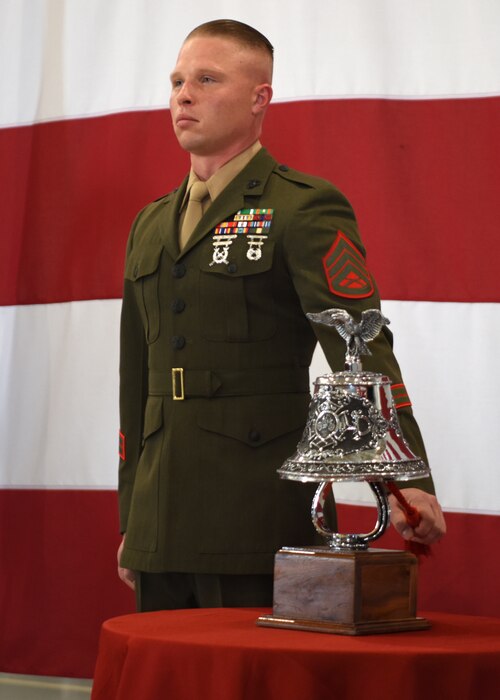 U.S. Marine Staff Sgt. Isaac Ross, Marine Detachment Goodfellow fire instructor, rings the last alarm at the 312th Training Squadron’s 9/11 memorial ceremony at the Louis F. Garland Department of Defense Fire Academy high bay, Goodfellow Air Force Base, Texas, Sept. 9, 2022. The last alarm is a tradition that started in the 1800s when a fire department would ring the bell when a responder fell in the line of duty. (U.S. Air Force photo by Senior Airman Ethan Sherwood)