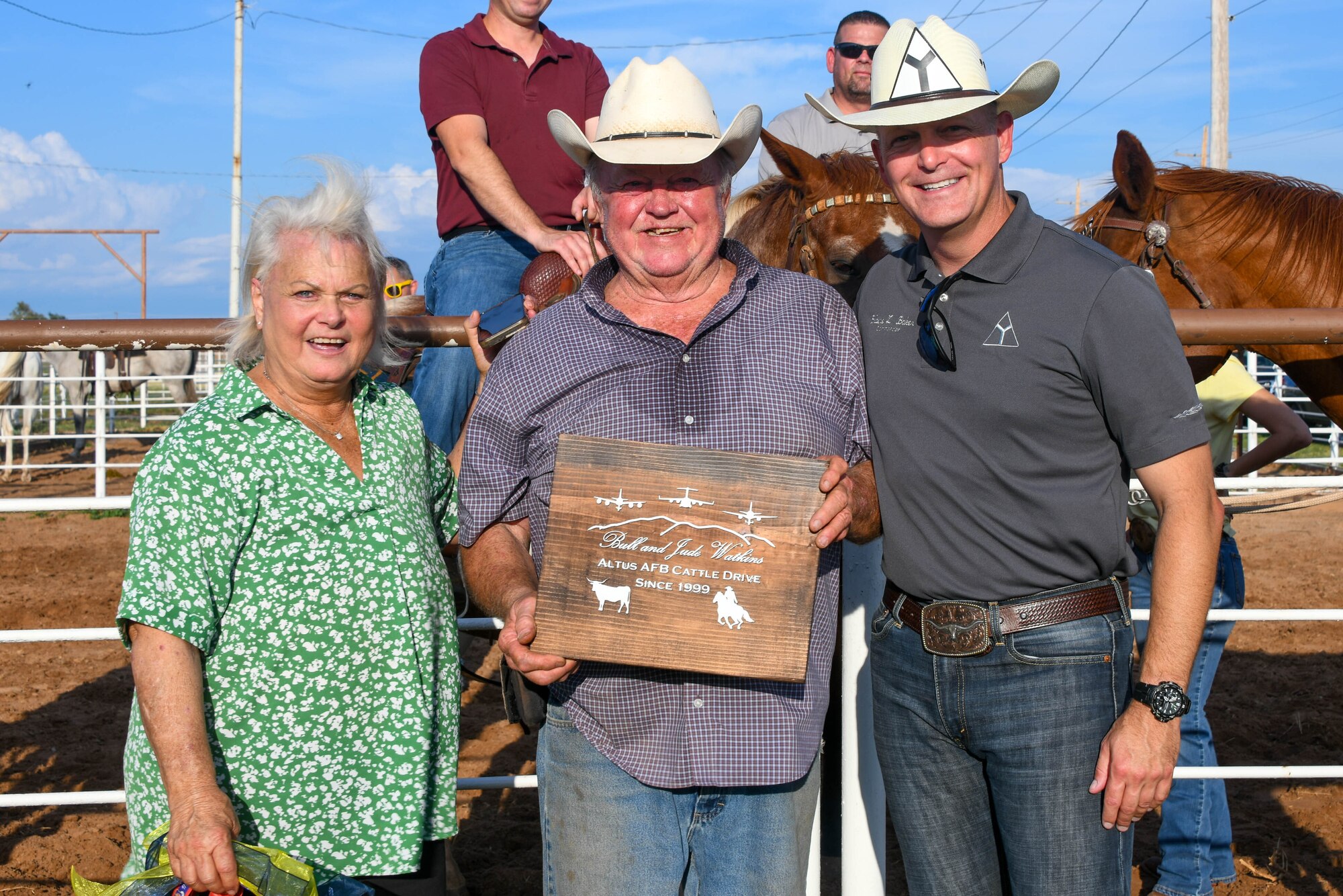 Gary “Bull” Watkins, a friend of Altus since 2011 and rancher (center), and his wife, Jude, pose with U.S. Air Force Col. Blaine Baker, 97th Air Mobility Wing commander, at the Watkins’ ranch in Altus, Oklahoma, Aug. 24, 2022. Watkins has given back to his community in many ways, serving18 years on the Altus City Council and as vice mayor for two of those years. (U.S. Air Force photo by Senior Airman Trenton Jancze)