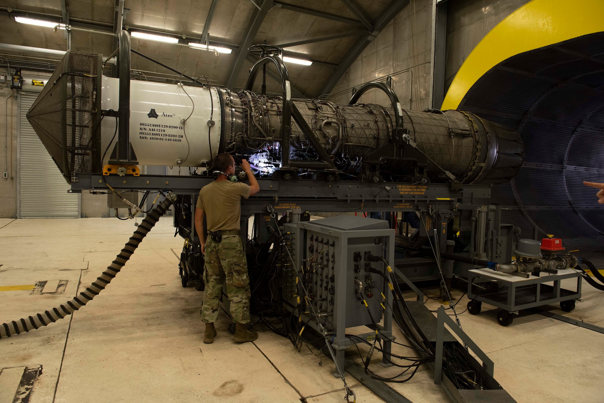 U.S. Air Force Senior Airman Alex Turnage, 49th Component Maintenance Squadron aerospace propulsion journeyman, inspects a Pratt & Whitney F100 turbofan engine at Holloman Air Force Base, New Mexico, Sept. 6, 2022. The 49th CMS produces peak functional engines for the F-16 Vipers here on base to ensure both the jets and their pilots are mission ready. (U.S. Air photo by Airman 1st Class Isaiah Pedrazzini)