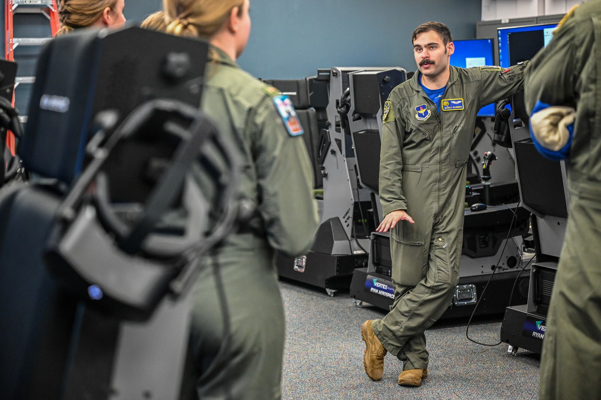 U.S. Air Force 1st Lt. Michael Blumberg, 85th Flying Training Squadron instructor pilot, showcases simulators used in modern pilot training at Laughlin Air Force Base, Texas, on Sept. 2, 2022. The 85th FTS celebrated its 50th anniversary at Laughlin by showcasing the modern pilot training experience to previous members and commanders. (U.S. Air Force photo by Airman 1st Class Keira Rossman)