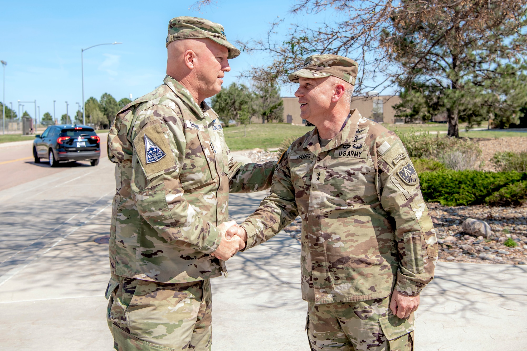 Two military men in uniform shaking hands