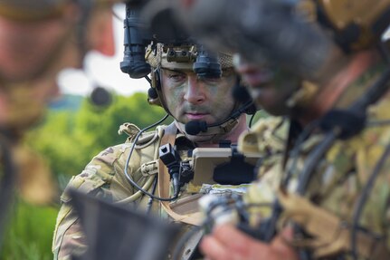 A Tactical Air Control Party specialist from the 148th Air Support Operations Squadron, a subordinate unit of the 193rd Special Operations Wing in Middletown, Pennsylvania, conducts ground operations that simulate capturing an enemy stronghold in hostile territory during a multifaceted exercise at Fort Indiantown Gap, Pennsylvania. Airmen from the 111th Attack Squadron, the 148th ASOS, and members of the 305th Air Mobility Wing and its associate reserve unit, the 514th Air Mobility Wing, took part in a two-part joint exercise that included the integration of MQ-9 Reaper’s ability to support ground troops and coordinate support for a C-17 Globemaster III flying over hostile territory during training at FIG’s Bollen Range.(U.S. Air National Guard Photo by Staff Sgt. Wilfredo Acosta, 111th Attack Wing Public Affairs)