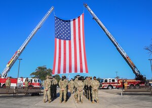 A flight of first responders stand at parade rest during a 9/11 remembrance ceremony at Joint Base Andrews, Md., Sept. 9, 2022. The ceremony was intended for base personnel to remember the tragic events on September 11, 2001 and honor the nearly 3,000 lives lost. (U.S. Air Force photo by Airman 1st Class Isabelle Churchill)