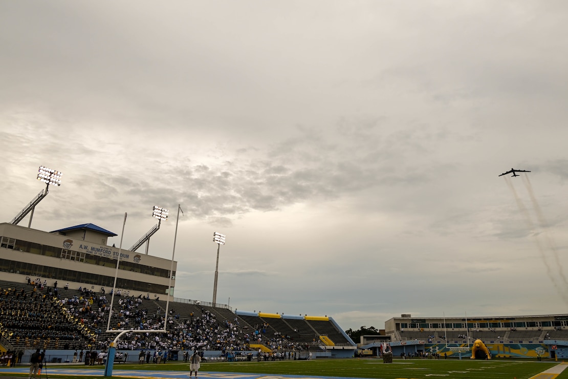 A B-52H Stratofortress assigned to Minot Air Force Base, North Dakota, flies over A.W. Mumford Stadium prior to the start of a college football game in Baton Rouge, La., Sept. 3, 2022. The event was held to promote recruitment and highlight Air Force Global Strike’s Project Tuskegee. (U.S. Air Force photo by Senior Airman Zachary Wright)