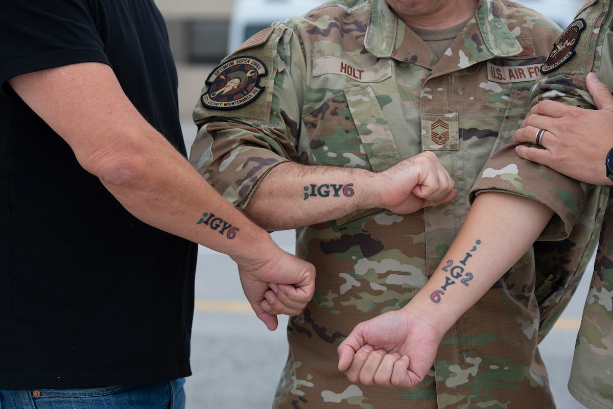 Three senior leaders share ;IGY6 tattoo on their arms.