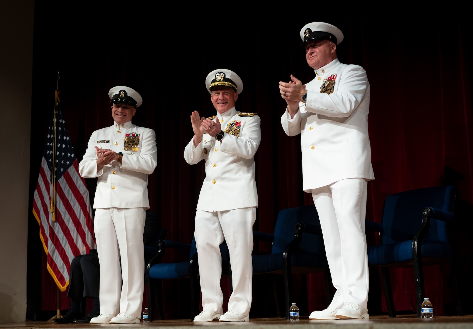 Chief of Naval Operations Adm. Mike Gilday, center, stands with Master Chief Petty Officer of the Navy (MCPON) Russell Smith, left, and MCPON James Honea during the MCPON Change of Office ceremony held at Mahan Hall, United States Naval Academy, Sept. 8, 2022.