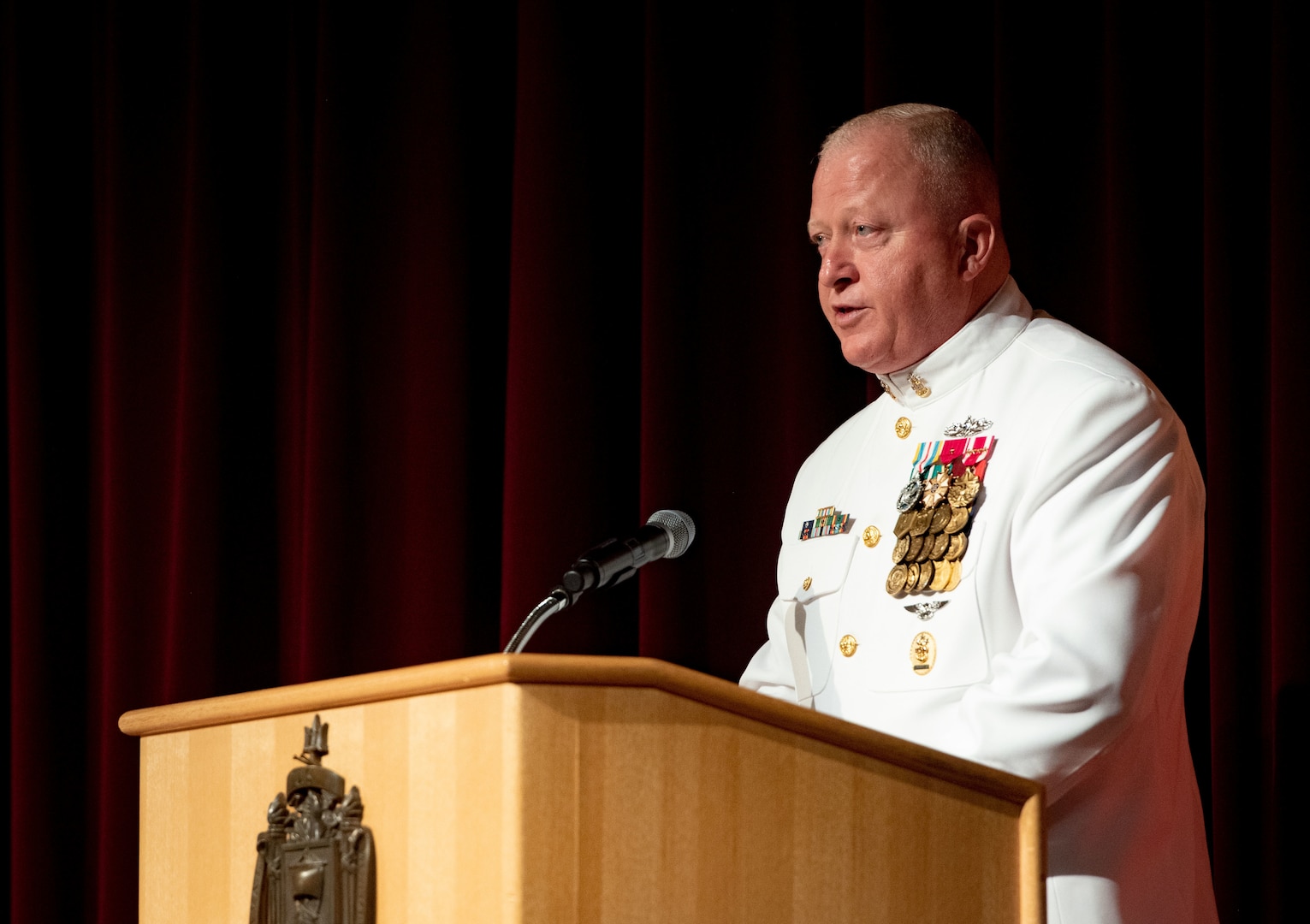 Master Chief Petty Officer of the Navy (MCPON) James Honea delivers remarks during the MCPON Change of Office ceremony held at Mahan Hall, United States Naval Academy, Sept. 8, 2022.