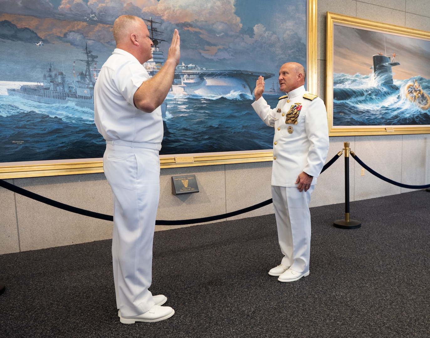 Chief of Naval Operations Adm. Mike Gilday, right, delivers the oath of enlistment to Master Chief Petty Officer of the Navy (MCPON) James Honea before the MCPON Change of Office ceremony held at Mahan Hall, United States Naval Academy, Sept. 8, 2022.