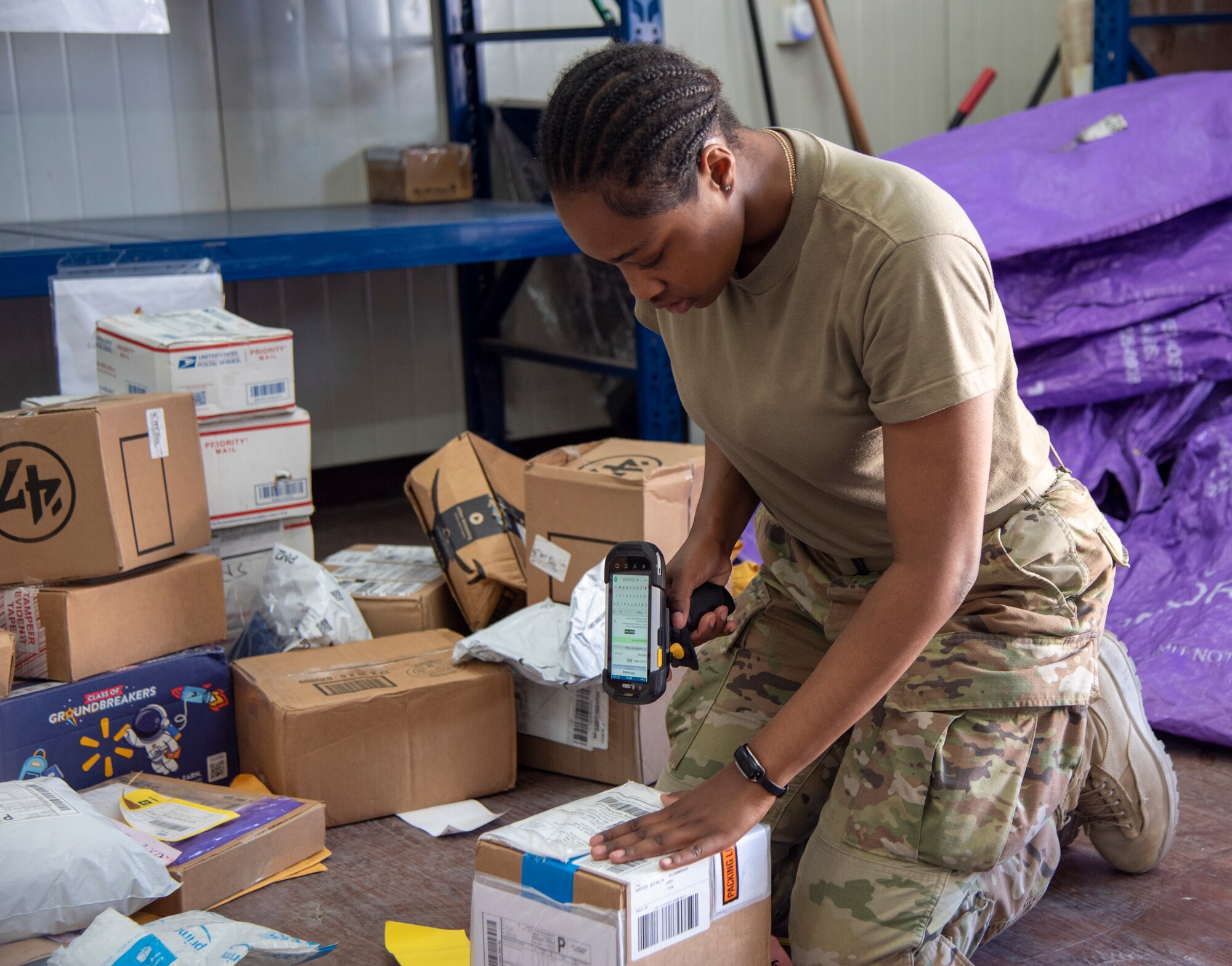 Volunteers and postal workers with the 332d Air Expeditionary Wing process incoming shipments at an undisclosed location in Southwest Asia, August 23, 2022. Each package must be inspected and sorted to make sure it gets to the right person. (U.S. Air Force photo by: Tech. Sgt. Jim Bentley)