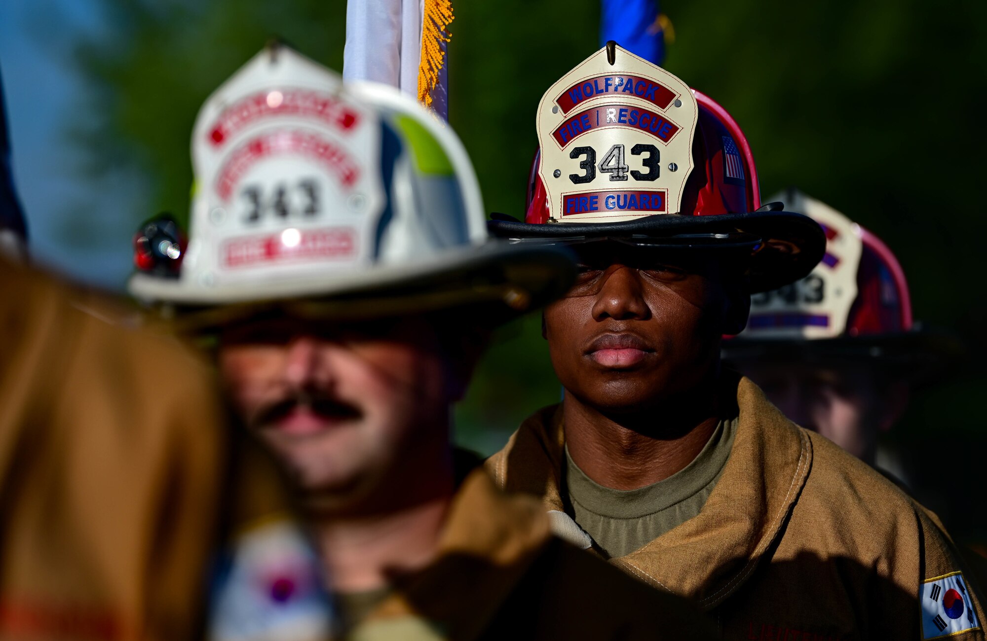 An 8th Civil Engineer Squadron honor guard member stands at attention during a 9/11 remembrance ceremony at Kunsan Air Base, Republic of Korea, Sept. 8, 2022. During the events of 9/11, 343 firefighters and one fire patrolman lost their lives while responding to the terrorist attack. (U.S. Air Force photo by Senior Airman Shannon Braaten)