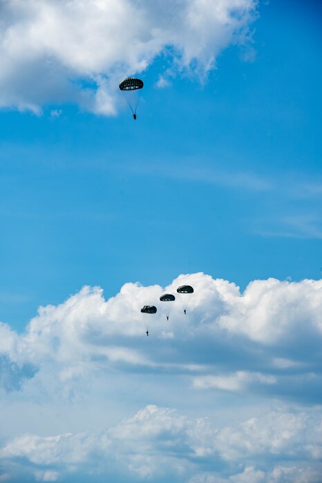 TACPs parachuting from aircraft.