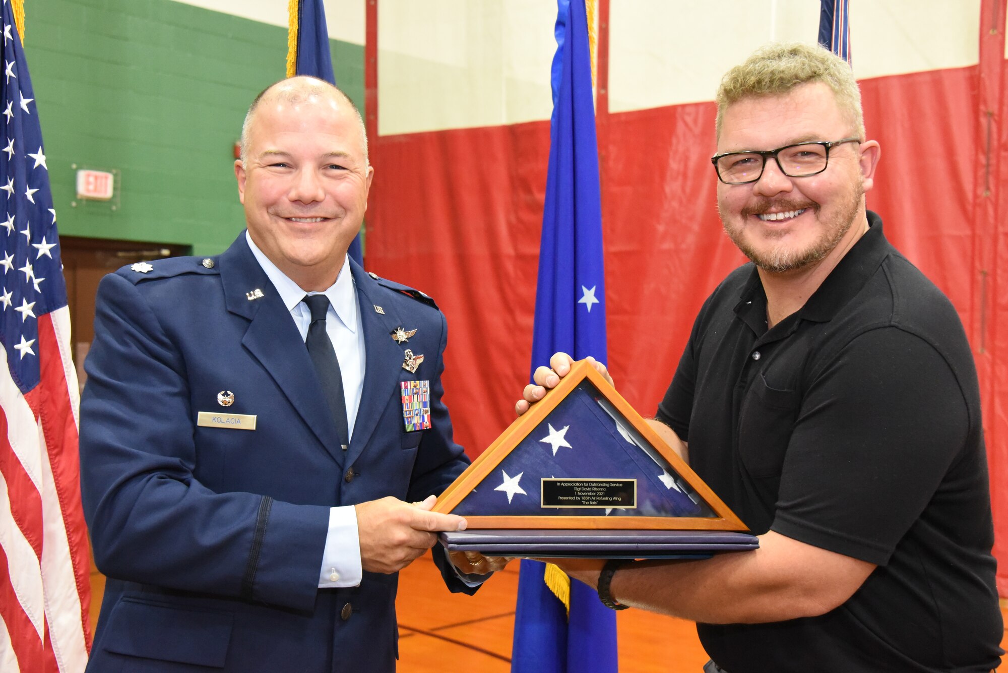 Tech. Sgt. David Ritsema is presented with a flag