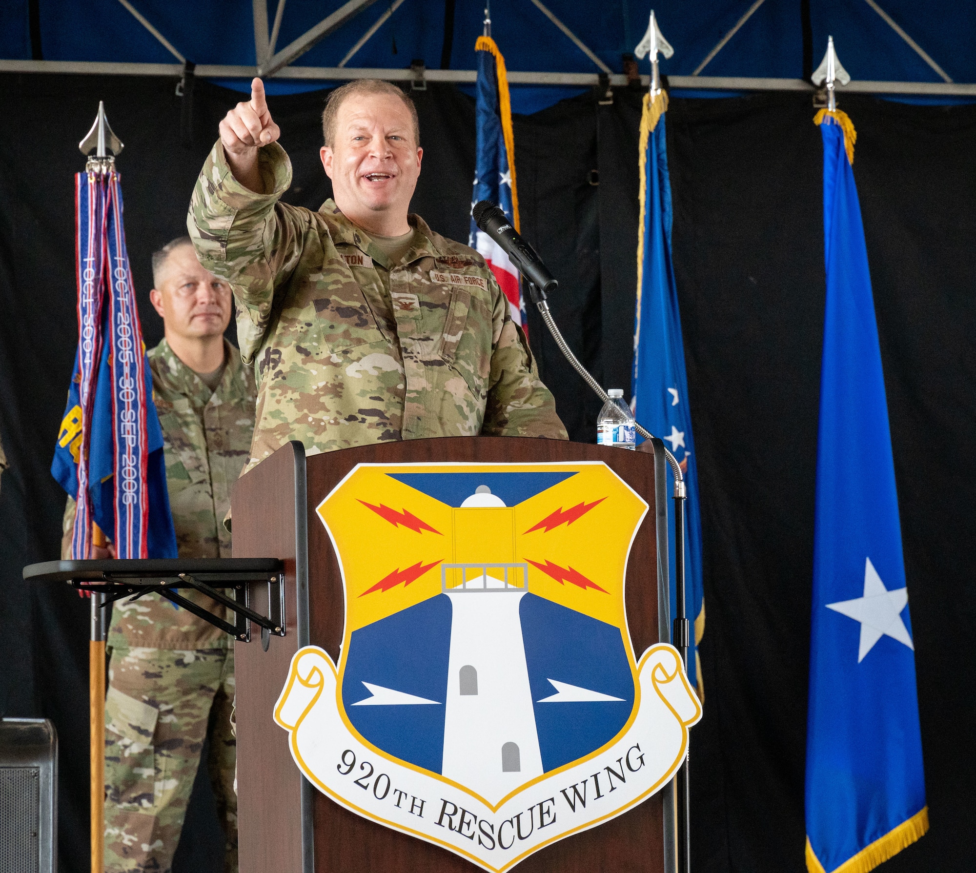 Col. Jesse Hamilton, 920th Rescue Wing commander, addresses the audience during a change of command ceremony Sept. 11, 2022, at Patrick Space Force Base, Florida. The 920th Rescue Wing's mission is to plan, lead, and conduct military rescue operations and missions to deny competitors and adversaries exploitation of isolated personnel. (U.S. Air Force photo by Master Sgt. Kelly Goonan)