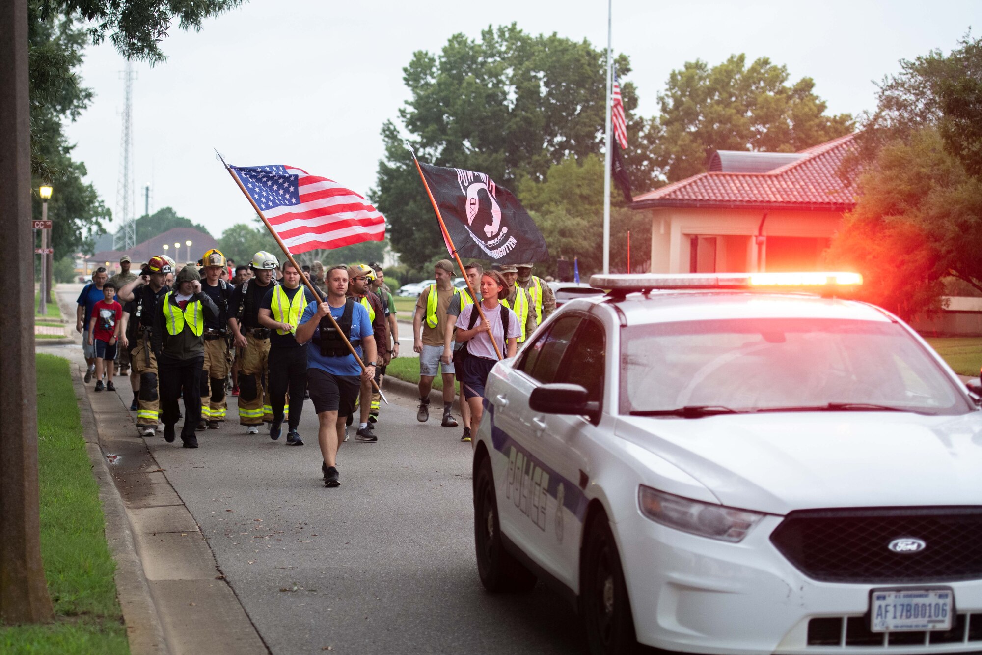 A group of military members and civilians march at Maxwell Air Force Base, September 9, 2022. The event was a Ruck March in remembrance of Prisoners of War and Missing in Action men and women.