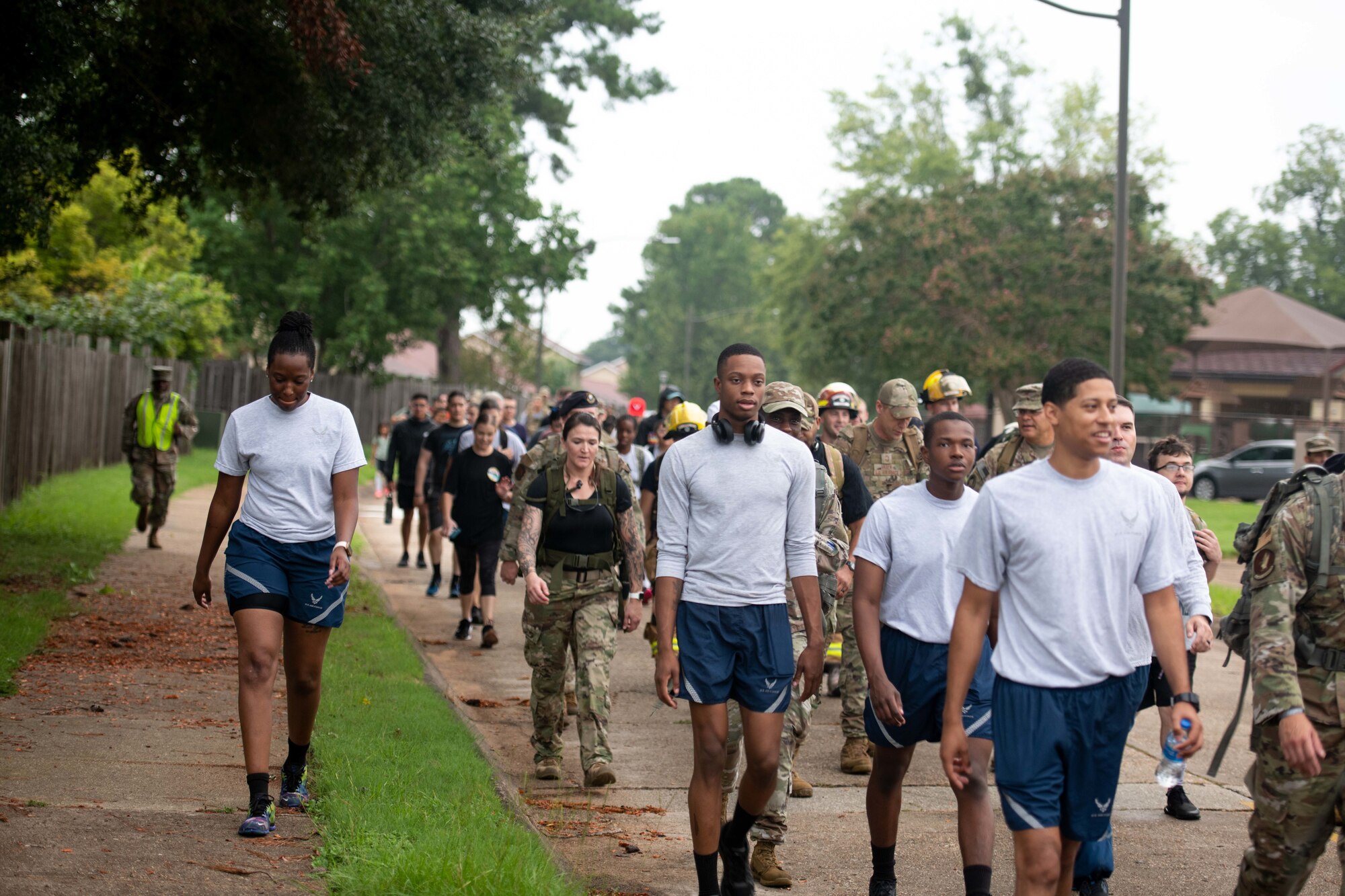 A group of military members and civilians march at Maxwell Air Force Base, September 9, 2022. The event was a Ruck March in remembrance of Prisoners of War and Missing in Action men and women.