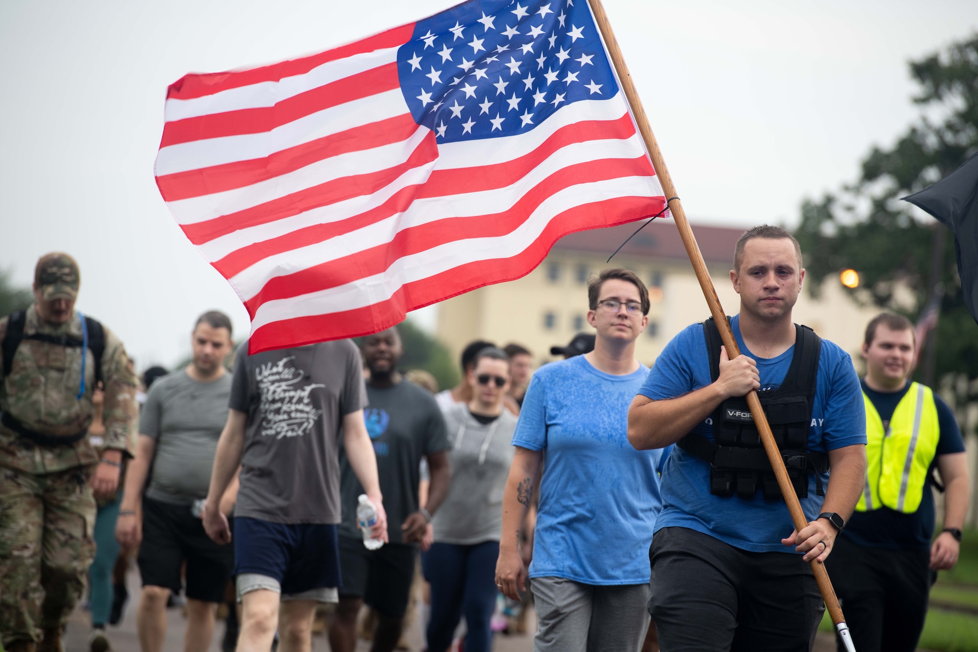 A group of military members and civilians march at Maxwell Air Force Base, September 9, 2022. The event was a Ruck March in remembrance of Prisoners of War and Missing in Action men and women.