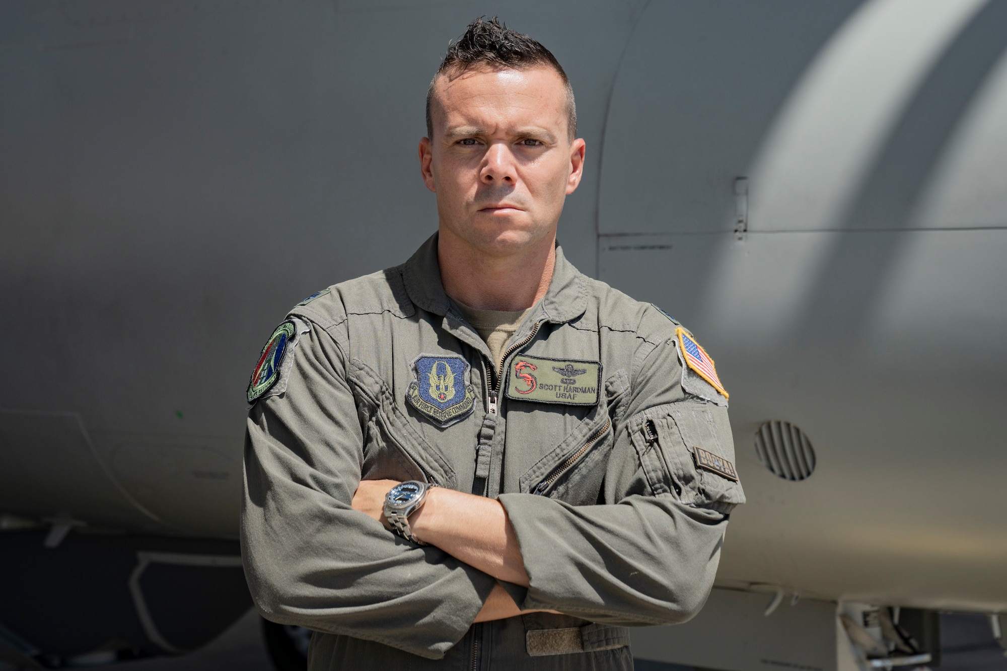 Lt. Col. Hardman poses in front of a U-28 Draco aircraft.