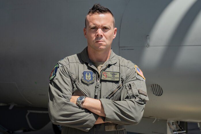 Lt. Col. Hardman poses in front of a U-28 Draco aircraft.
