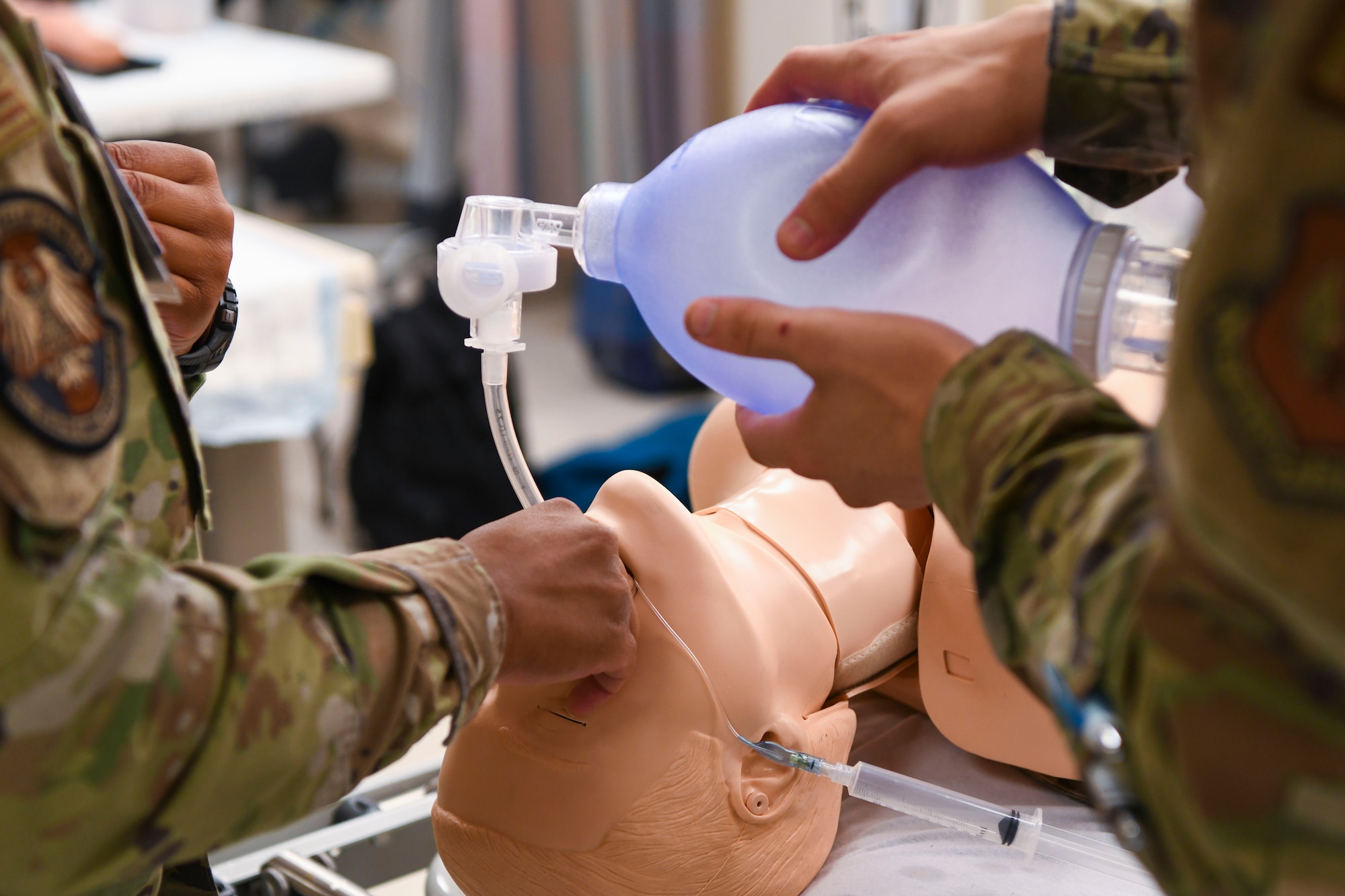 U.S. Air Force Airmen practice managing an airway on a training mannequin