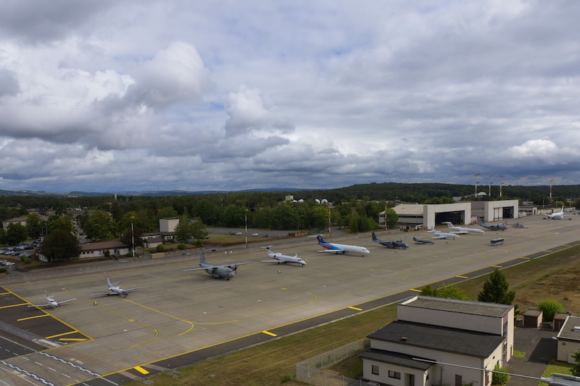 Planes line up on a flight line.