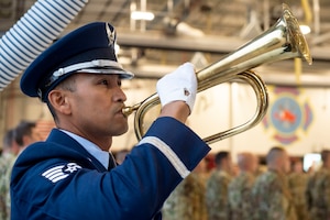 Staff Sgt. Jeffrey Merza, Grissom honor guardsmen, plays Taps on the bugle during the 9/11 Remembrance ceremony, September 11, 2022, at Grissom Air Reserve Base, Indiana. The ceremony was held in remembrance of the 2,996 lives lost during the events on September 11, 2001. (U.S. Air Force photo by Staff Sgt. Alexa Culbert)