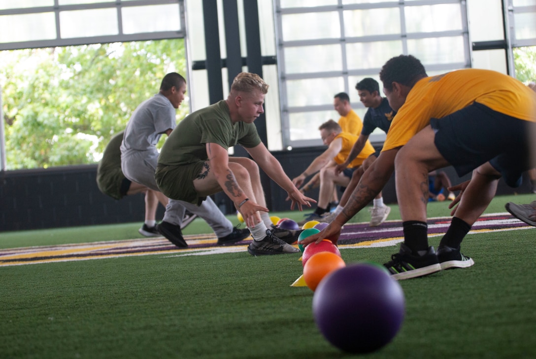 U.S. Marines, Sailors and Coast Guard cadets participate in a physical training event in Baltimore, Maryland, Sept. 10, 2022. Maryland Fleet Week & Flyover Baltimore is an annual public event that celebrates the contributions of the U.S. sea services and maritime capabilities from the U.S. Marine Corps, U.S. Navy and U.S. Coast Guard. More than 2,300 service members participated in Maryland Fleet Week & Flyover Baltimore 2022 engaging and assisting with ship tours, live bands and static equipment displays. (U.S. Marine Corps photo by Lance Cpl. Angel Alvarado)