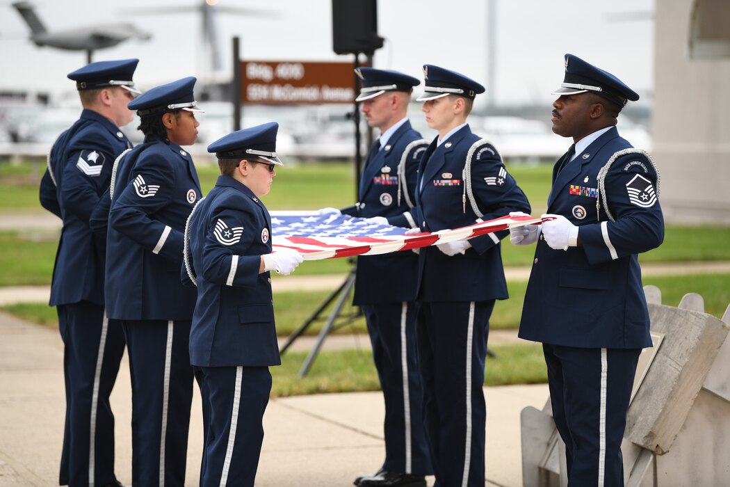 Reserve Citizen Airmen from the Wright-Patterson AFB Honor Guard conduct a flag folding presentation in honor of the memory of 9/11 during the 445th AW 9/11 ceremony Sept. 11, 2022. The flag was then presented to Col. Raymond Smith, Jr., 445th AW commander.