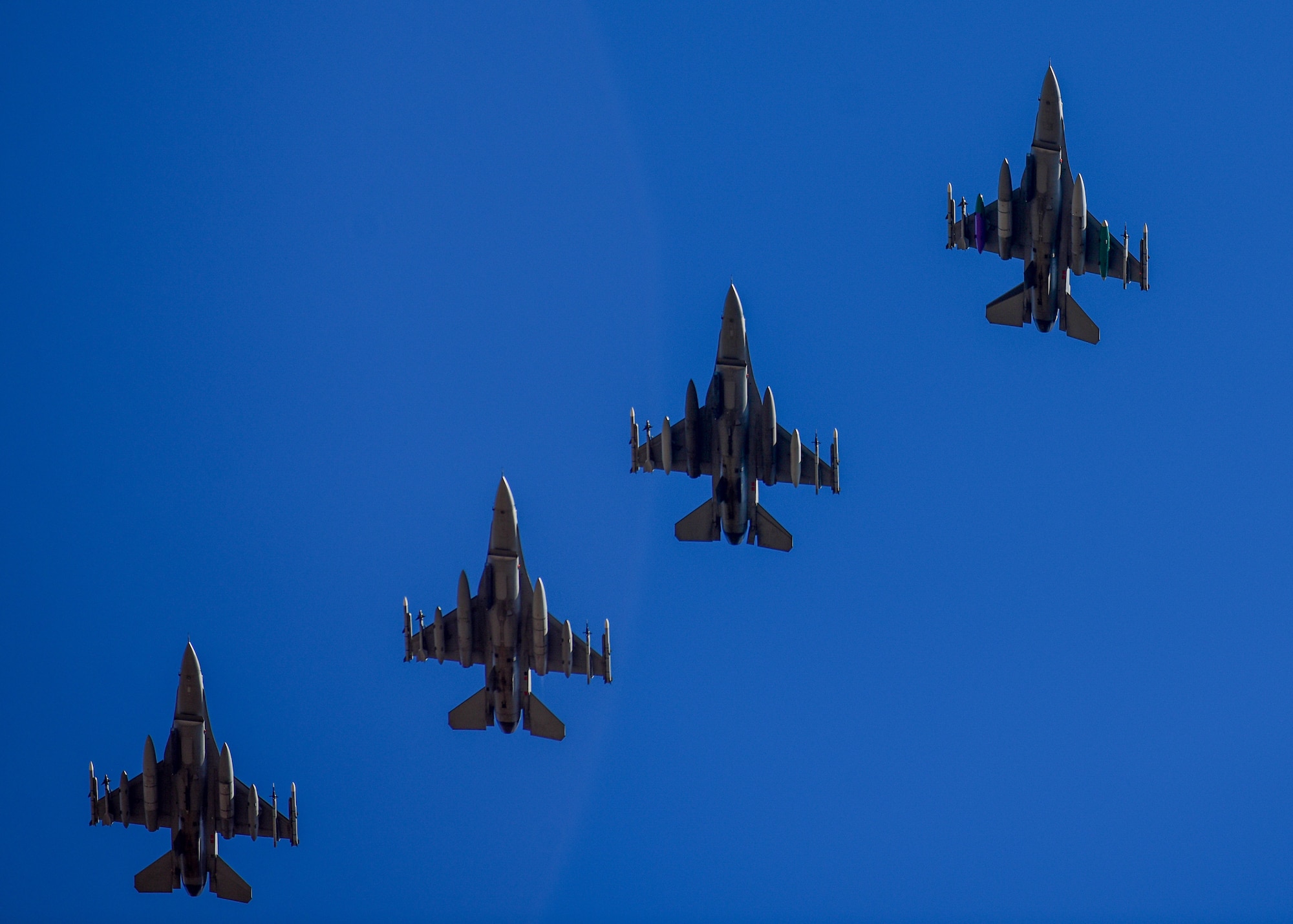 A four-ship of U.S. Air Force F-16C Fighting Falcons, assigned to the 555th Fighter Squadron from the 31st Fighter Wing, Aviano Air Base, Italy, prepare to land