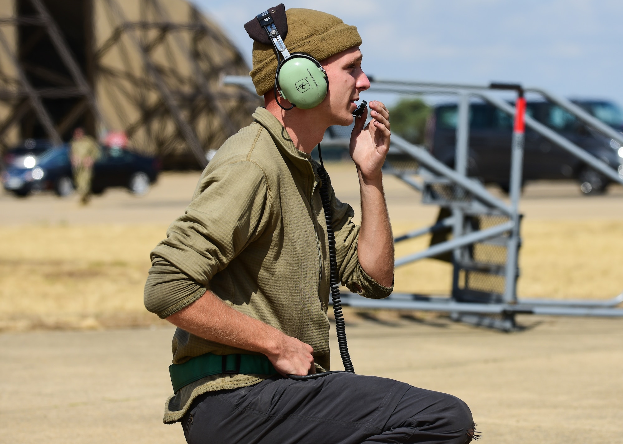 Airman 1st Class Michael Schutzius, 555th Fighter Generation Squadron crew chief from the 31st Fighter Wing, Aviano Air Base, Italy, communicates with an F-16C Fighting Falcon pilot over radio, before take-off, during pre-exercise training for Cobra Warrior 2022